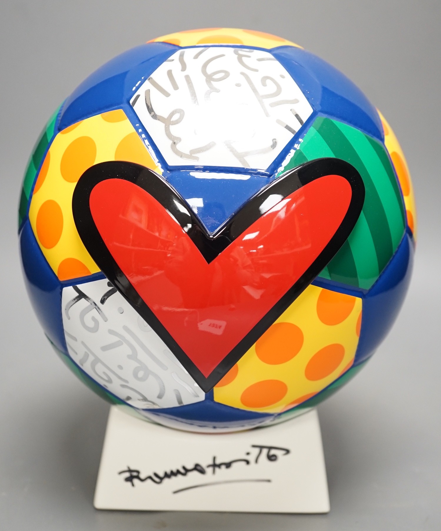 Romero Britto (Brazilian, 1963-), a ceramic football, 26cm